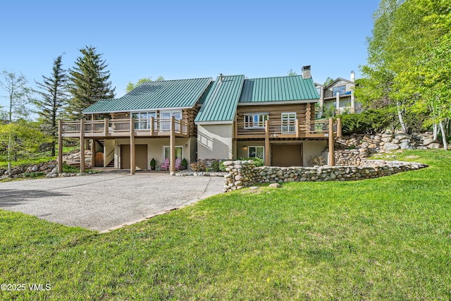 121 Hackamore Rd Unit B, Edwards, CO 81632 - rear view of property with stairs, asphalt driveway, log siding, and a wooden deck