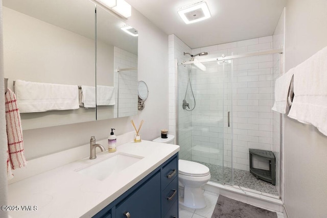 216 Main St Unit R316, Edwards, CO 81632 - bathroom featuring vanity, heating unit, a stall shower, and tile patterned flooring