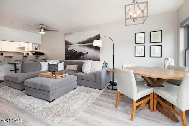 216 Main St Unit R316, Edwards, CO 81632 - living room with light wood-style floors, a chandelier, and a ceiling fan