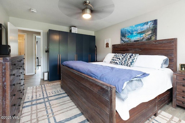 216 Main St Unit R316, Edwards, CO 81632 - bedroom with light wood-style flooring and a ceiling fan