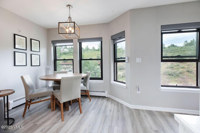 216 Main St Unit R316, Edwards, CO 81632 - dining room with baseboard heating, light wood finished floors, and healthy amount of natural light