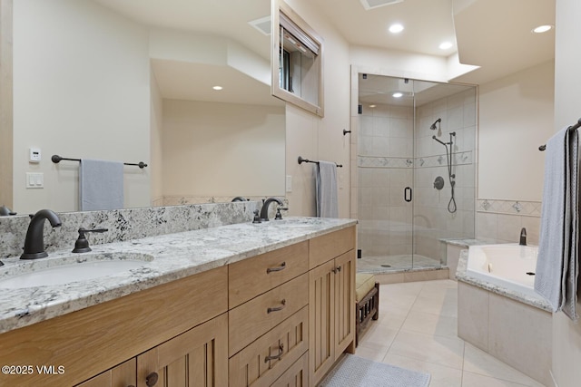 12 Cabin Creek Ln, Edwards, CO 81632 - bathroom featuring a bath, a shower stall, double vanity, tile patterned flooring, and recessed lighting