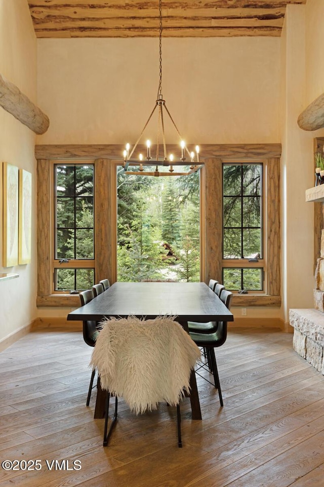 12 Cabin Creek Ln, Edwards, CO 81632 - dining room with a chandelier, light wood-type flooring, and a high ceiling