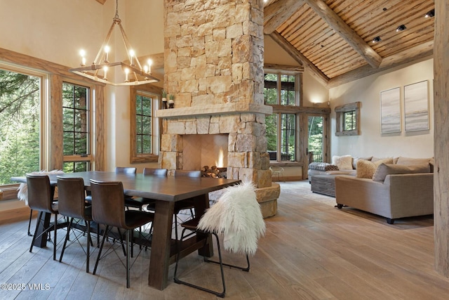 12 Cabin Creek Ln, Edwards, CO 81632 - dining area with high vaulted ceiling, wood-type flooring, a chandelier, a wooden ceiling with exposed beams, and plenty of natural light