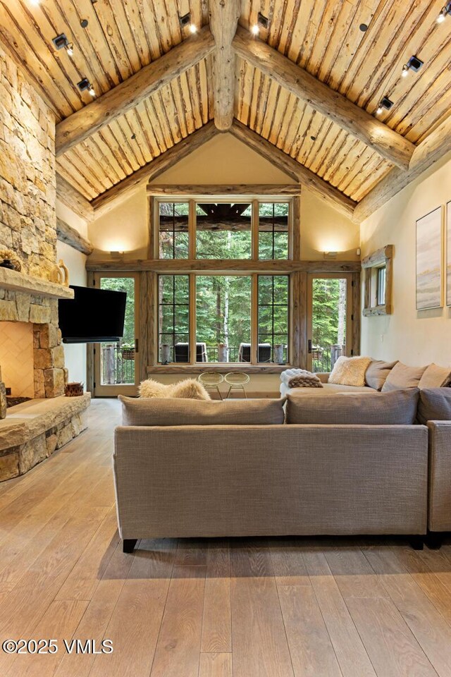 12 Cabin Creek Ln, Edwards, CO 81632 - living area featuring a wood ceiling with exposed beams, hardwood / wood-style flooring, and high vaulted ceiling