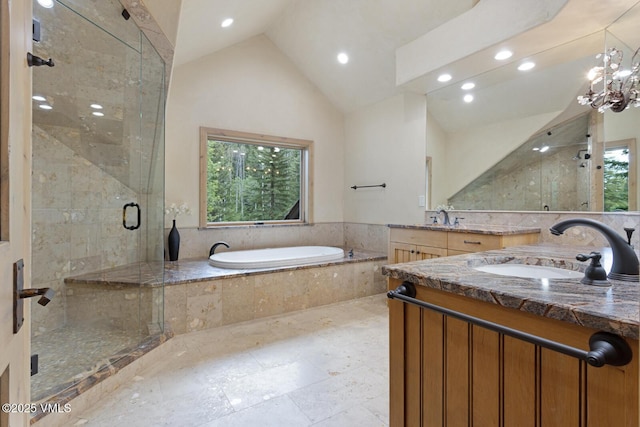 12 Cabin Creek Ln, Edwards, CO 81632 - full bathroom with vaulted ceiling, a bath, vanity, a stall shower, and healthy amount of natural light