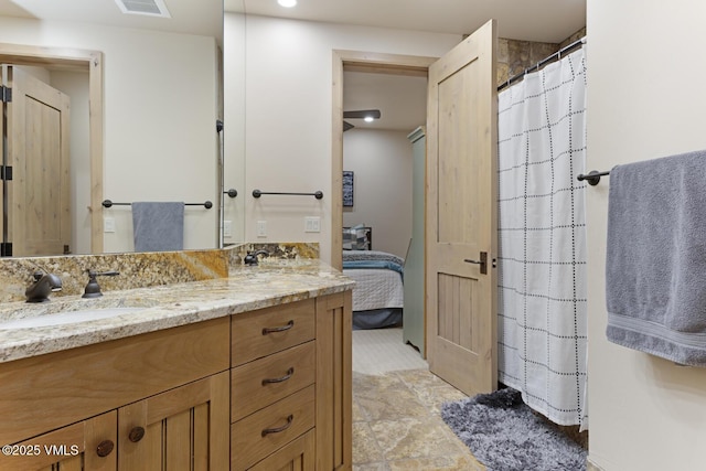 12 Cabin Creek Ln, Edwards, CO 81632 - full bath featuring double vanity, connected bathroom, and curtained shower