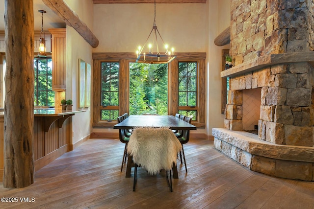 12 Cabin Creek Ln, Edwards, CO 81632 - dining room featuring a chandelier, hardwood / wood-style flooring, a towering ceiling, and beamed ceiling
