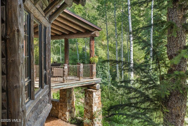 12 Cabin Creek Ln, Edwards, CO 81632 - wooden deck featuring a wooded view