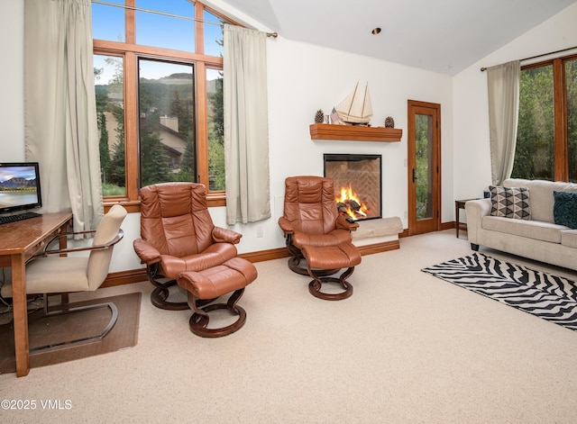3827 Lupine Dr Unit B, Vail, CO 81657 - living area featuring vaulted ceiling, a warm lit fireplace, and carpet flooring