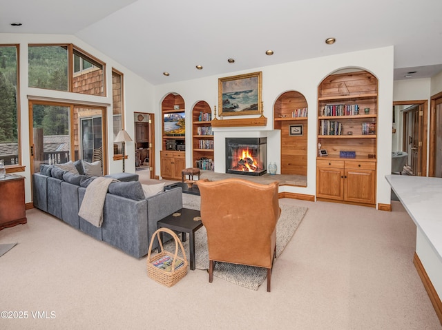 3827 Lupine Dr Unit B, Vail, CO 81657 - living room featuring light carpet, a glass covered fireplace, built in features, and vaulted ceiling