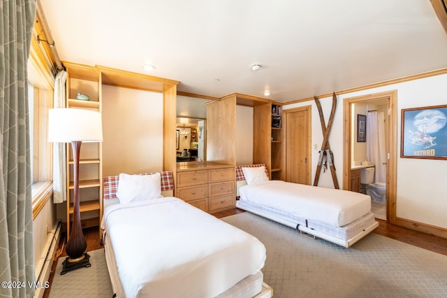595 Vail Valley Dr Unit 115, Vail, CO 81657 - bedroom featuring wood finished floors, recessed lighting, and ensuite bathroom