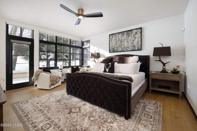 bedroom with hardwood / wood-style floors and ceiling fan