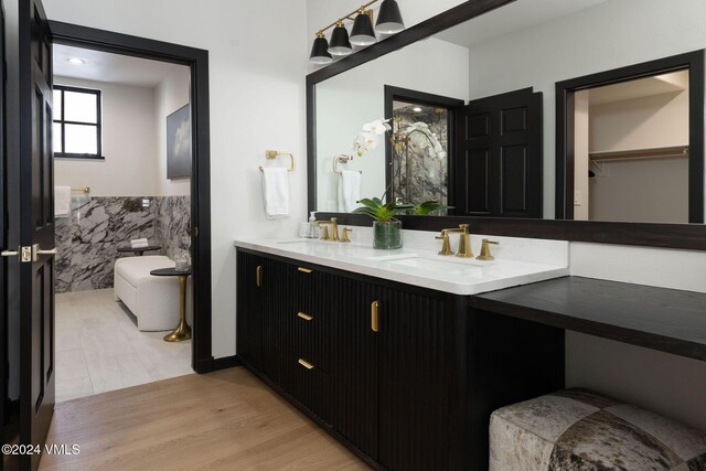 bathroom featuring vanity and hardwood / wood-style flooring