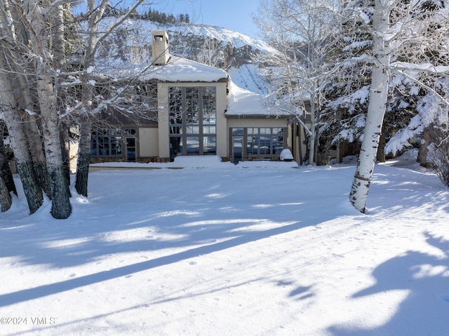 view of front of property with a mountain view