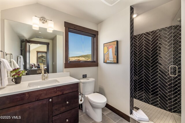 687 Hunters View Ln, Eagle, CO 81631 - full bath featuring a stall shower, vanity, toilet, lofted ceiling, and tile patterned flooring