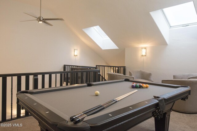 playroom with lofted ceiling with skylight, carpet flooring, ceiling fan, and billiards