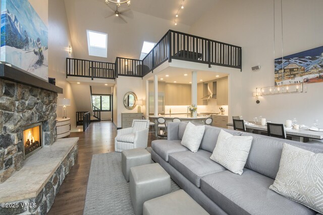 living room with hardwood / wood-style floors and a fireplace