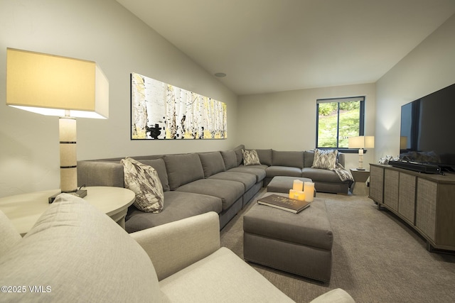 living room featuring vaulted ceiling and carpet flooring