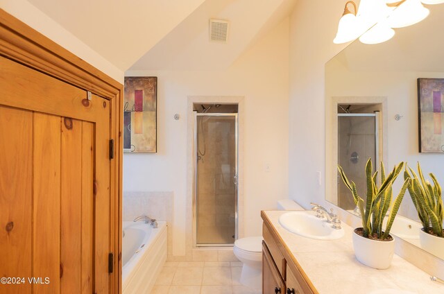 full bathroom featuring tile patterned floors, shower with separate bathtub, and toilet