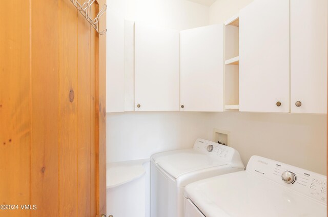 laundry area with cabinets and washer and dryer