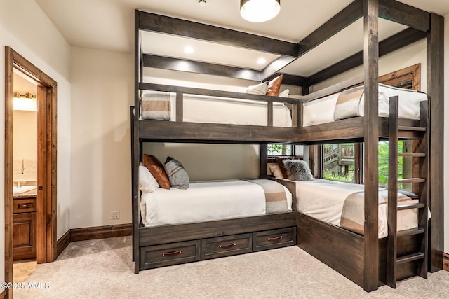 2417 Garmisch Dr Unit B, Vail, CO 81657 - carpeted bedroom with beam ceiling and connected bathroom