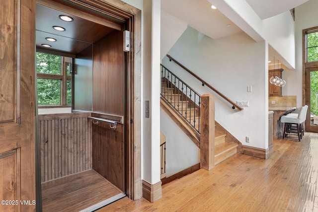 2417 Garmisch Dr Unit B, Vail, CO 81657 - stairway with wood-type flooring, elevator, and recessed lighting
