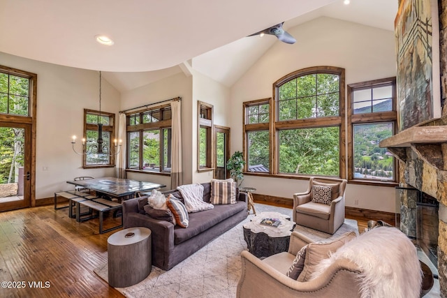 2417 Garmisch Dr Unit B, Vail, CO 81657 - living area with high vaulted ceiling, wood-type flooring, and a chandelier