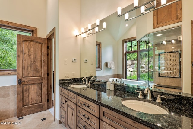 2417 Garmisch Dr Unit B, Vail, CO 81657 - full bathroom with double vanity, a tub, and tile patterned floors