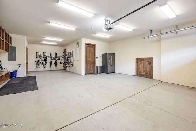 2417 Garmisch Dr Unit B, Vail, CO 81657 - garage with stainless steel fridge, electric panel, and a garage door opener
