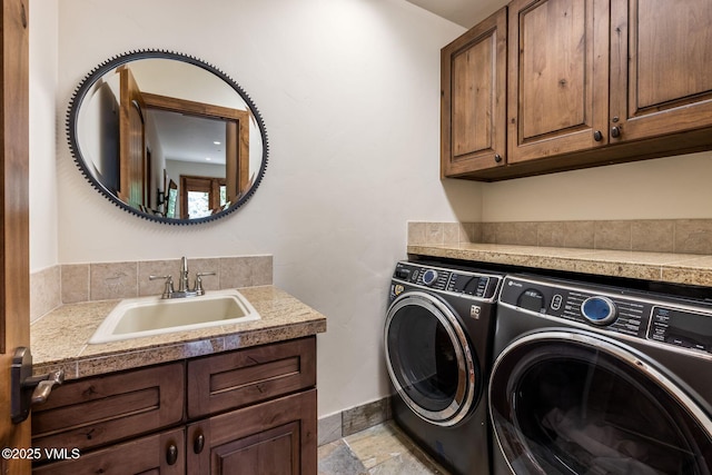 2417 Garmisch Dr Unit B, Vail, CO 81657 - laundry room with washing machine and dryer, cabinet space, and stone finish flooring