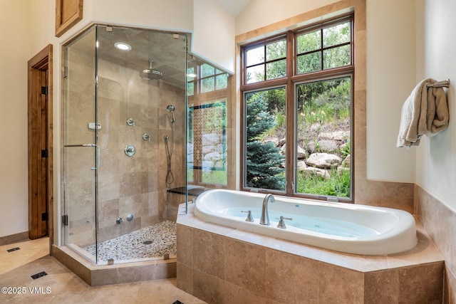 2417 Garmisch Dr Unit B, Vail, CO 81657 - bathroom with a bath, a shower stall, and tile patterned floors