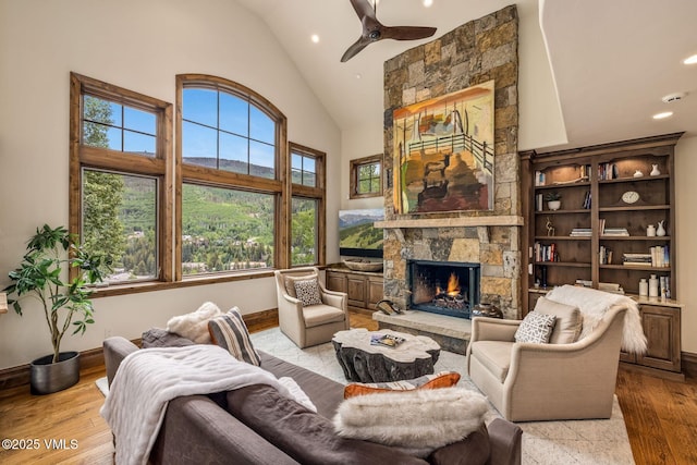 2417 Garmisch Dr Unit B, Vail, CO 81657 - living area with high vaulted ceiling, hardwood / wood-style floors, recessed lighting, a fireplace, and ceiling fan