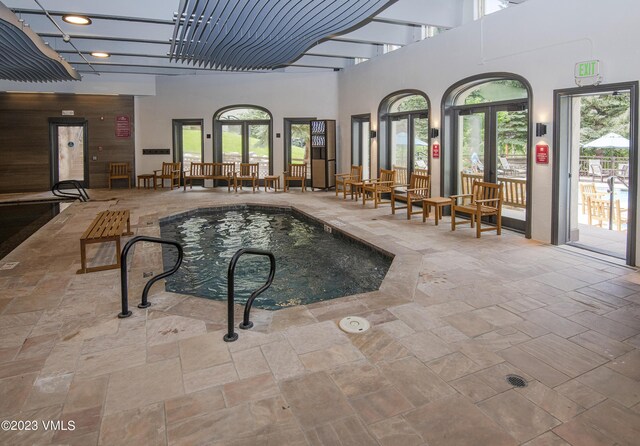 view of pool with french doors