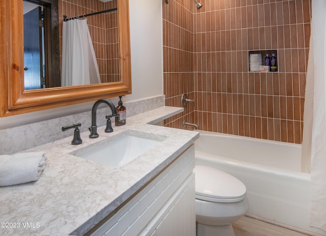 full bathroom with vanity, toilet, and shower / bathtub combination with curtain