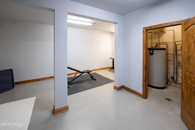 exercise room featuring gas water heater