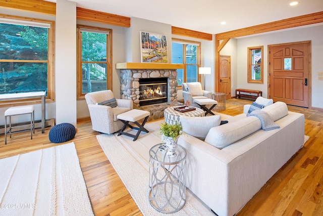 405 Greenwaye Cir Unit 11-A, Eagle-Vail, CO 81620 - living area featuring baseboard heating, recessed lighting, a stone fireplace, and wood finished floors