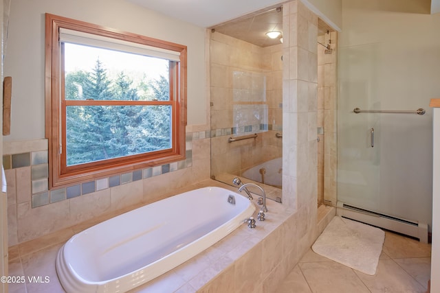 405 Greenwaye Cir Unit 11-A, Eagle-Vail, CO 81620 - bathroom with baseboard heating, a garden tub, a shower stall, and tile patterned floors