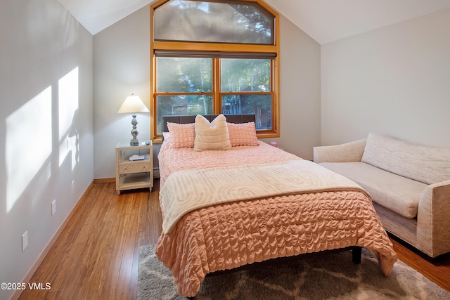 405 Greenwaye Cir Unit 11-A, Eagle-Vail, CO 81620 - bedroom with vaulted ceiling and wood finished floors