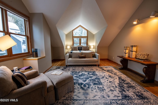 bedroom with vaulted ceiling and light hardwood / wood-style floors