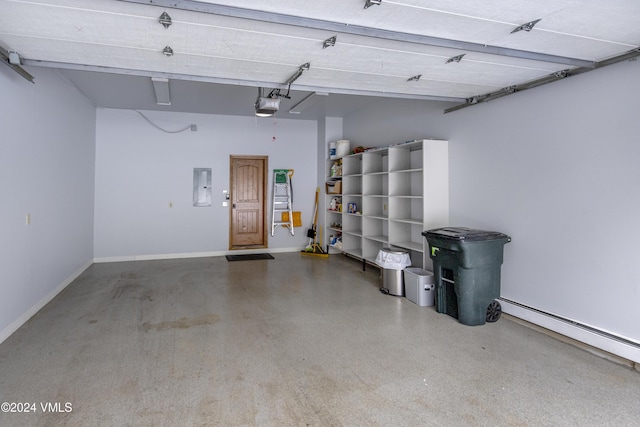 garage featuring a garage door opener, electric panel, and baseboard heating