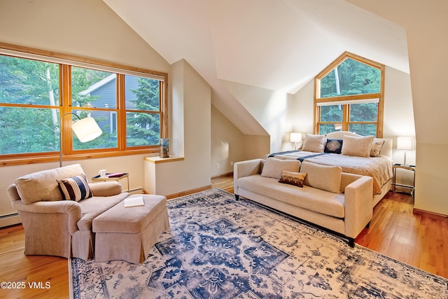 405 Greenwaye Cir Unit 11-A, Eagle-Vail, CO 81620 - bedroom with lofted ceiling, light wood-style flooring, and baseboard heating