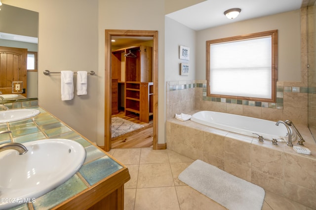 405 Greenwaye Cir Unit 11-A, Eagle-Vail, CO 81620 - bathroom with double vanity, a garden tub, and tile patterned floors
