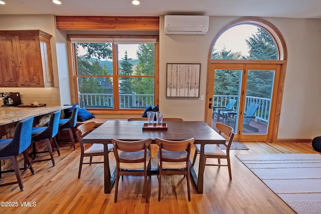 405 Greenwaye Cir Unit 11-A, Eagle-Vail, CO 81620 - dining space with a wall mounted air conditioner, recessed lighting, and light wood-style flooring