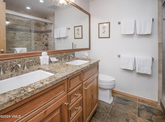 1100 N Frontage Rd Unit 1519, Vail, CO 81657 - full bathroom with double vanity, a shower stall, recessed lighting, and stone finish flooring