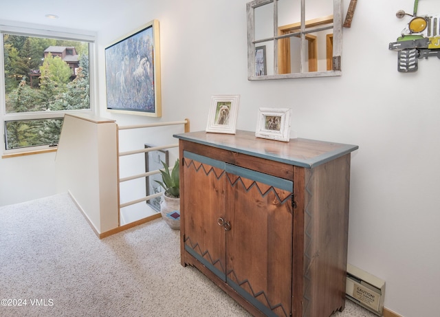 1100 N Frontage Rd Unit 1519, Vail, CO 81657 - hallway with a baseboard heating unit, light colored carpet, and an upstairs landing