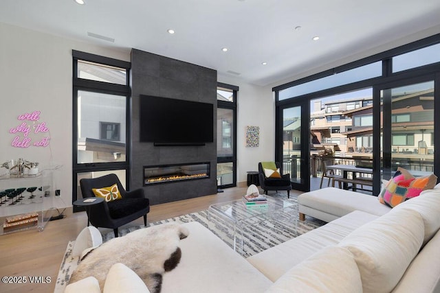42 Riverfront Ln Unit Th-13, Avon, CO 81620 - living area featuring wood finished floors, recessed lighting, and a fireplace