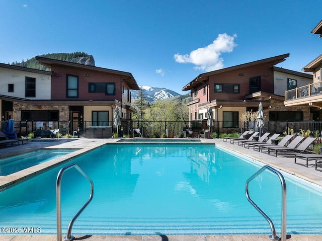42 Riverfront Ln Unit Th-13, Avon, CO 81620 - community pool featuring a mountain view and a patio