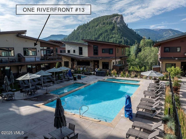42 Riverfront Ln Unit Th-13, Avon, CO 81620 - community pool with a mountain view and a patio