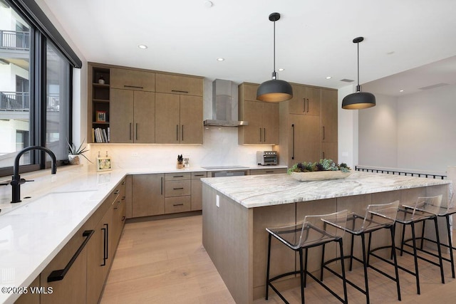 42 Riverfront Ln Unit Th-13, Avon, CO 81620 - kitchen with wall chimney range hood, a sink, open shelves, black electric stovetop, and a spacious island